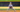 Baseball player performing fielding baseball drills in full baseball uniform on a baseball diamond