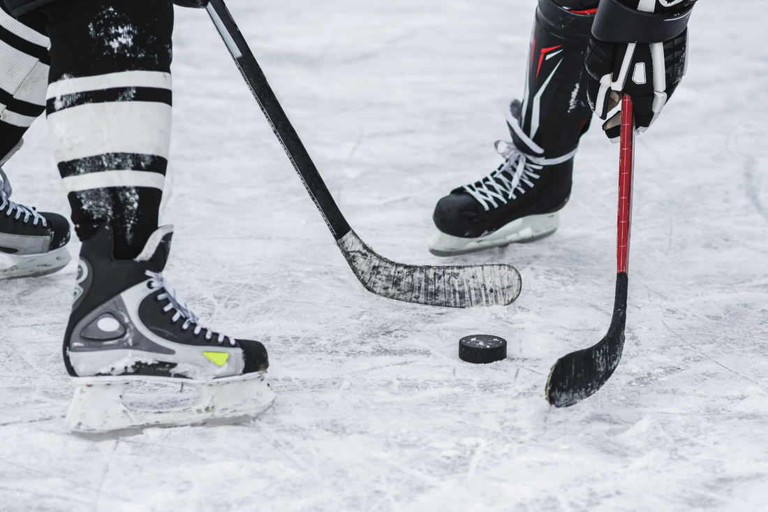 Demonstrating short girp hit in ice hockey using VukGripz hockey stick tape to wrap around hockey stick
