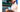 Baseball player holding a baseball and baseball glove in a baseball uniform at a baseball field