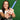 Vuk athlete holding a wooden softball bat wrapped in VukGrip softball bat grip tape